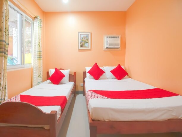 Imagen de la habitación del Hotel OYO 787 Indino Guest House 2and5. Foto 32