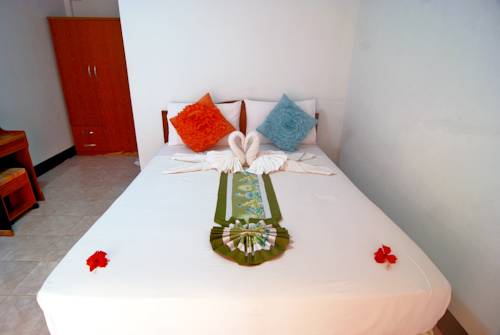 Imagen de la habitación del Hotel OYO 797 Pink House Bungalow. Foto 5