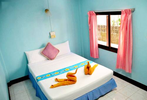 Imagen de la habitación del Hotel OYO 797 Pink House Bungalow. Foto 8