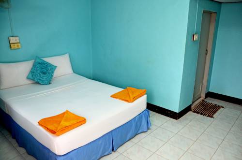 Imagen de la habitación del Hotel OYO 797 Pink House Bungalow. Foto 12