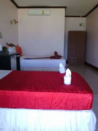 Imagen de la habitación del Hotel OYO 797 Pink House Bungalow. Foto 16