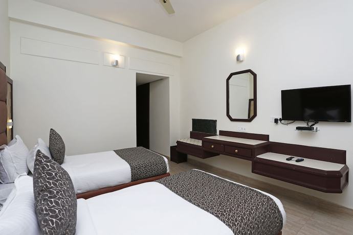 Imagen de la habitación del Hotel OYO 8078 The Central Palm. Foto 9