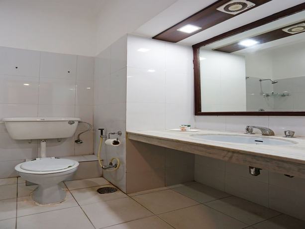 Imagen de la habitación del Hotel OYO 8078 The Central Palm. Foto 11