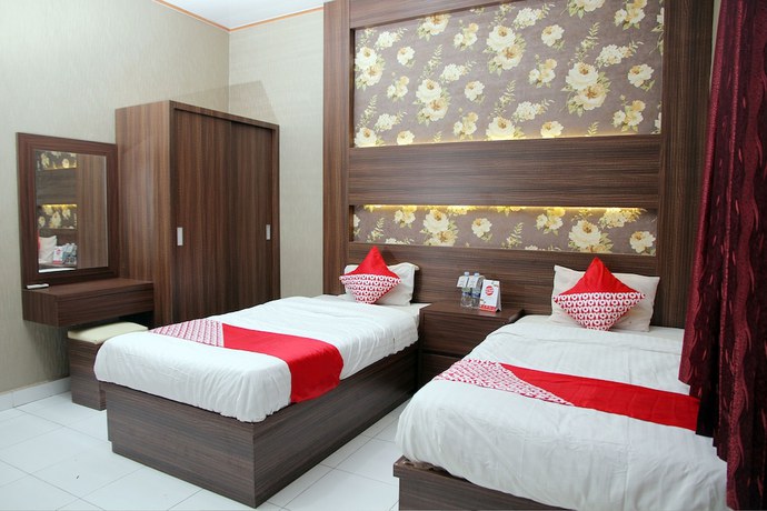 Imagen de la habitación del Hotel OYO 840 Dely. Foto 2