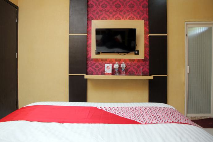 Imagen de la habitación del Hotel OYO 840 Dely. Foto 3