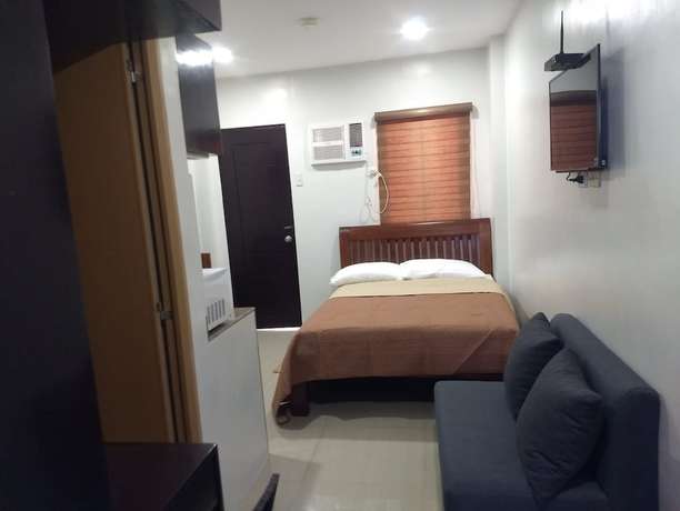 Imagen de la habitación del Hotel OYO 848 Dona Aurora Condotel. Foto 11