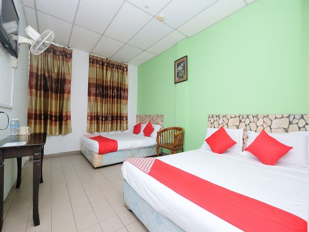 Imagen de la habitación del Hotel OYO 850 Gold Star Hotel. Foto 11