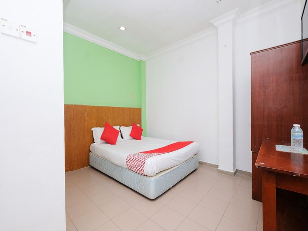 Imagen de la habitación del Hotel OYO 850 Gold Star Hotel. Foto 12