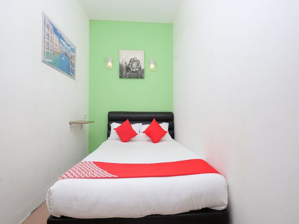 Imagen de la habitación del Hotel OYO 850 Gold Star Hotel. Foto 13