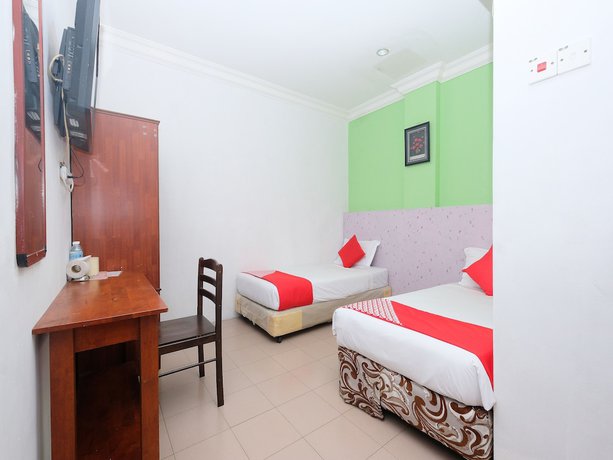 Imagen de la habitación del Hotel OYO 850 Gold Star Hotel. Foto 15