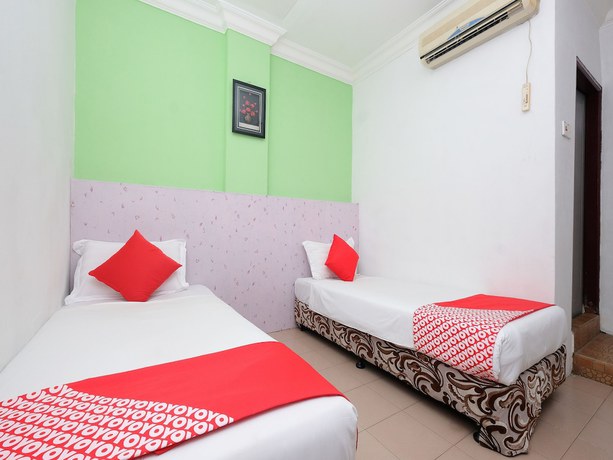 Imagen de la habitación del Hotel OYO 850 Gold Star Hotel. Foto 16