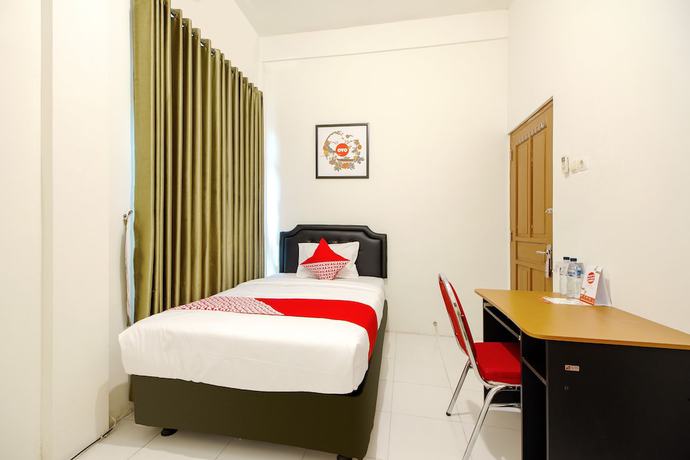 Imagen de la habitación del Hotel OYO 851 Rumah Mumu Kost and Homestay. Foto 7