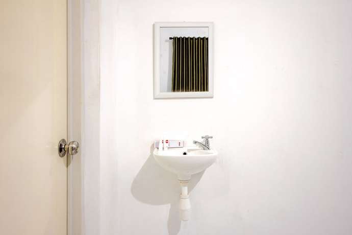 Imagen de la habitación del Hotel OYO 851 Rumah Mumu Kost and Homestay. Foto 8