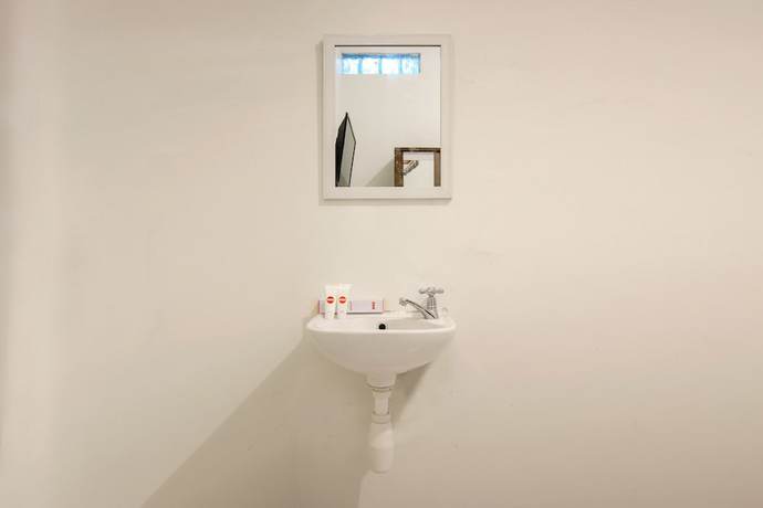 Imagen de la habitación del Hotel OYO 851 Rumah Mumu Kost and Homestay. Foto 13