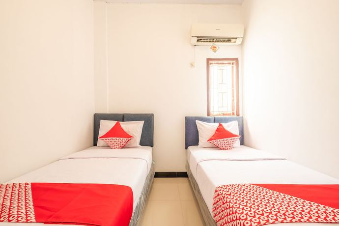 Imagen de la habitación del Hotel OYO 863 Tenacity Guest House Syariah. Foto 7