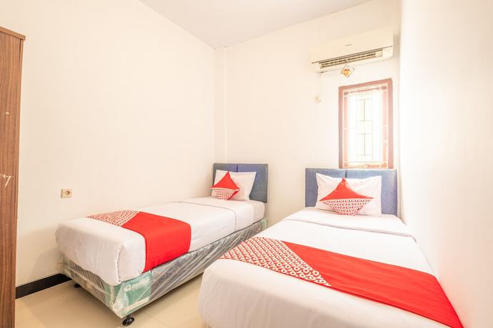 Imagen de la habitación del Hotel OYO 863 Tenacity Guest House Syariah. Foto 8
