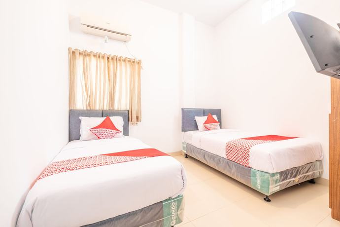 Imagen de la habitación del Hotel OYO 863 Tenacity Guest House Syariah. Foto 9