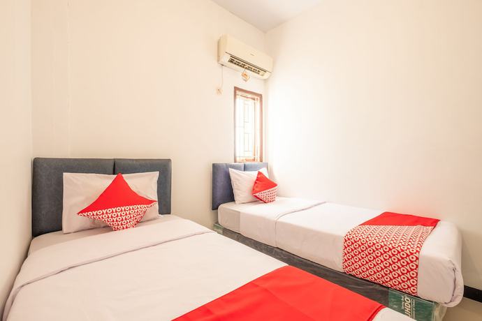 Imagen de la habitación del Hotel OYO 863 Tenacity Guest House Syariah. Foto 10