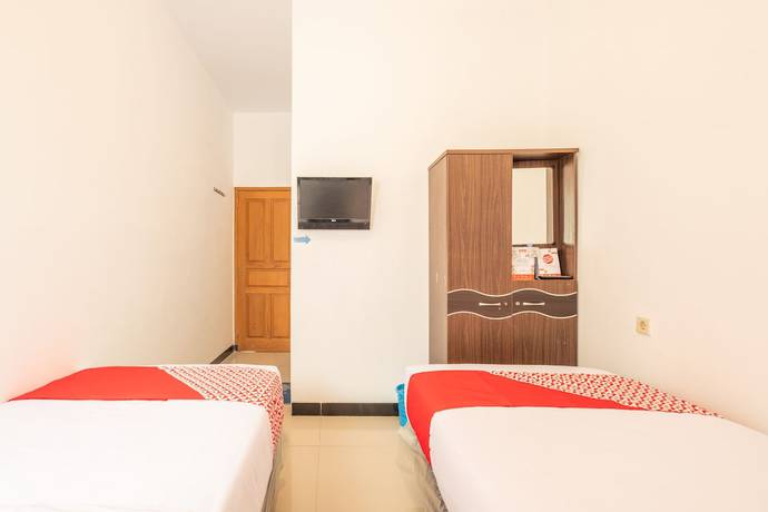 Imagen de la habitación del Hotel OYO 863 Tenacity Guest House Syariah. Foto 11