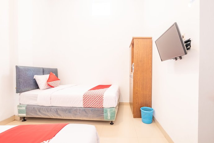 Imagen de la habitación del Hotel OYO 863 Tenacity Guest House Syariah. Foto 12