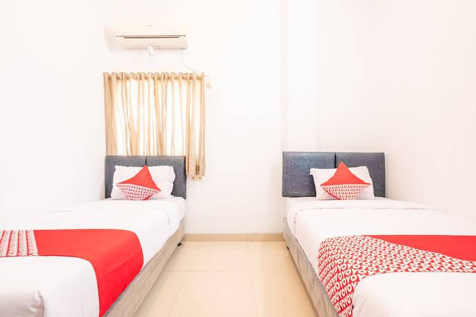 Imagen de la habitación del Hotel OYO 863 Tenacity Guest House Syariah. Foto 15