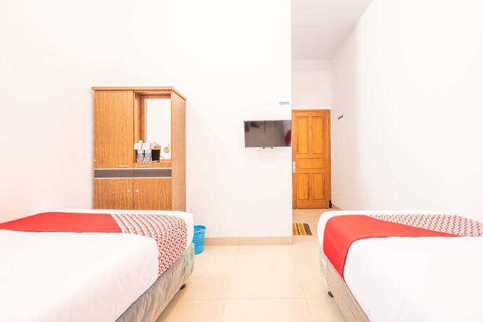 Imagen de la habitación del Hotel OYO 863 Tenacity Guest House Syariah. Foto 16