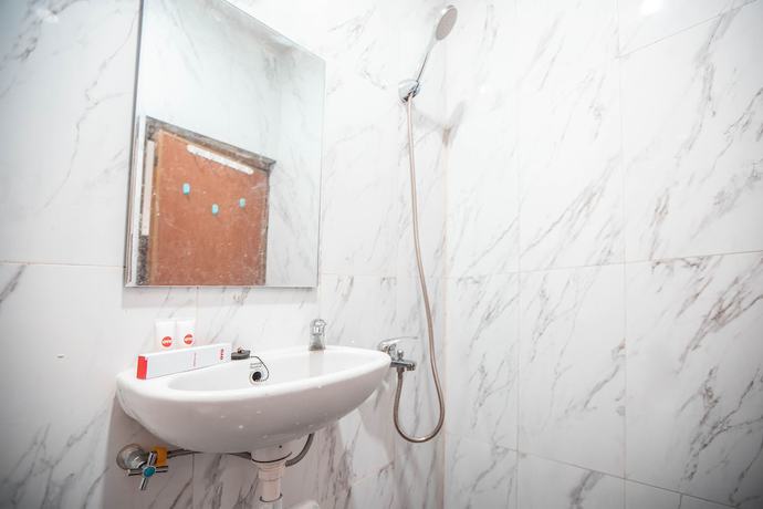 Imagen de la habitación del Hotel OYO 868 Wisma Berkat. Foto 11