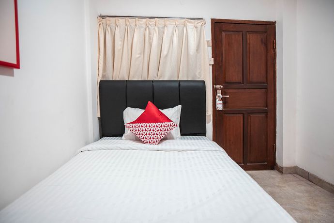 Imagen de la habitación del Hotel OYO 868 Wisma Berkat. Foto 13