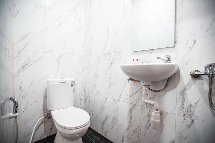 Imagen de la habitación del Hotel OYO 868 Wisma Berkat. Foto 14