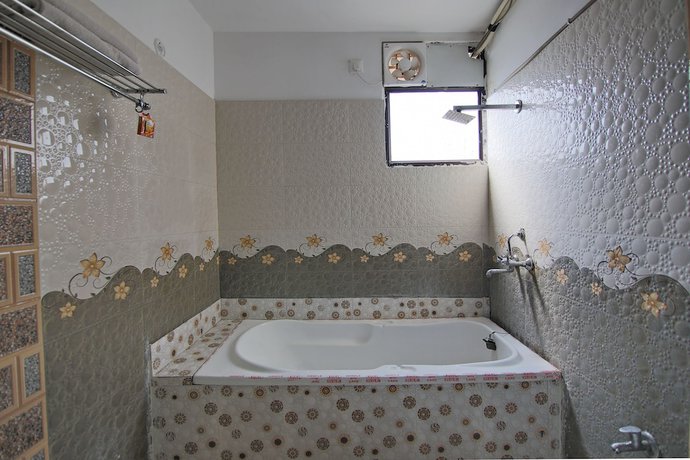 Imagen de la habitación del Hotel OYO 8764 Green View Palace. Foto 16