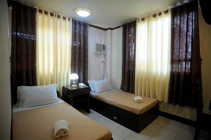 Imagen de la habitación del Hotel OYO 880 Flores De Musa Inn. Foto 13