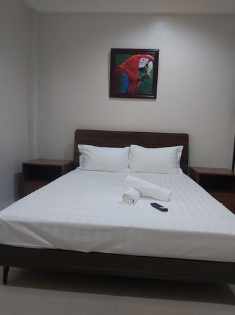 Imagen de la habitación del Hotel OYO 881 Nest Suites. Foto 8