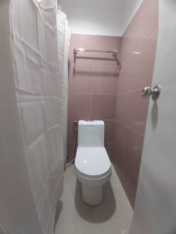 Imagen de la habitación del Hotel OYO 881 Nest Suites. Foto 9