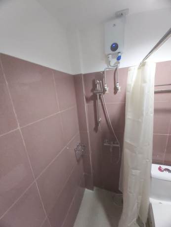 Imagen de la habitación del Hotel OYO 881 Nest Suites. Foto 10