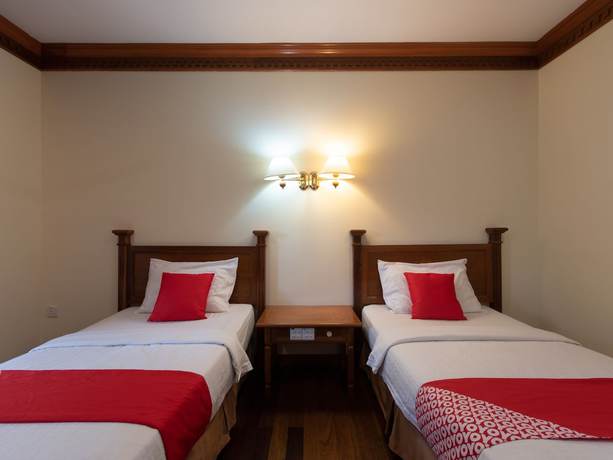 Imagen de la habitación del Hotel OYO 89300 Zen Garden Resort. Foto 9