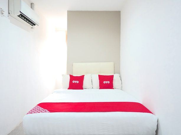 Imagen de la habitación del Hotel OYO 89373 Nobel Homestay. Foto 15