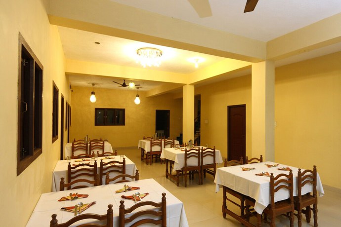 Imagen del bar/restaurante del Hotel OYO 8938 near Auroville Beach. Foto 4