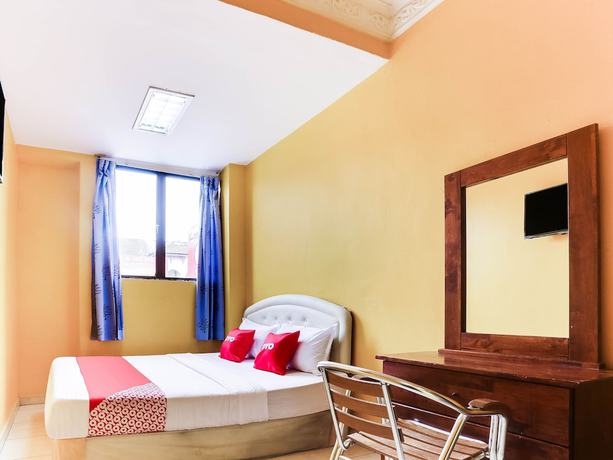 Imagen de la habitación del Hotel OYO 89406 Lucky Budget. Foto 6