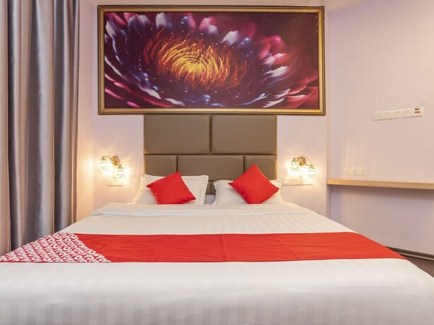 Imagen de la habitación del Hotel OYO 89423 Zenz Hotel. Foto 11