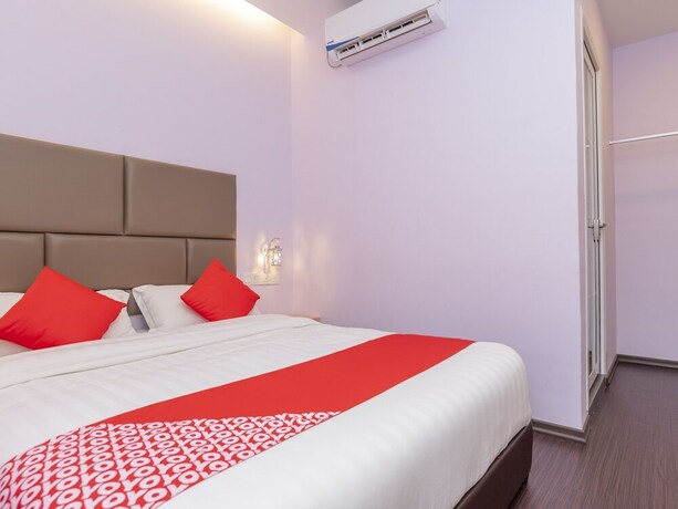 Imagen de la habitación del Hotel OYO 89423 Zenz Hotel. Foto 12