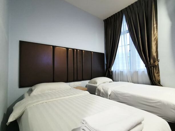 Imagen de la habitación del Hotel OYO 89423 Zenz Hotel. Foto 27