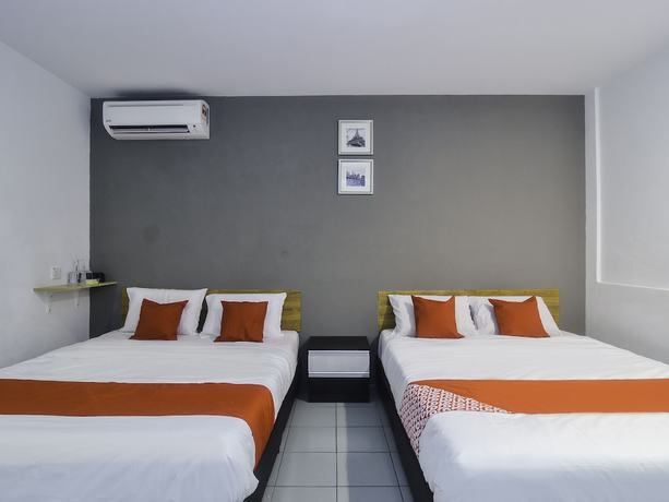 Imagen de la habitación del Hotel OYO 89465 Golden Lounge. Foto 2