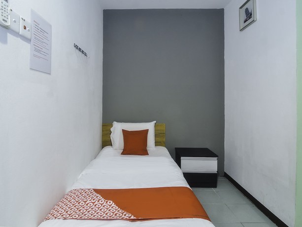 Imagen de la habitación del Hotel OYO 89465 Golden Lounge. Foto 7