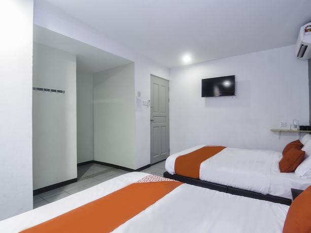Imagen de la habitación del Hotel OYO 89465 Golden Lounge. Foto 8