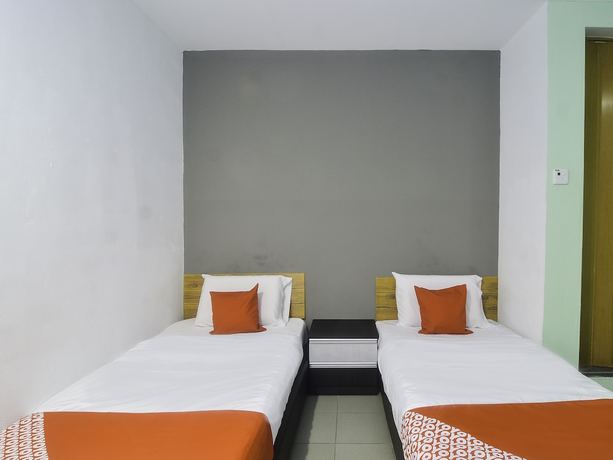 Imagen de la habitación del Hotel OYO 89465 Golden Lounge. Foto 12