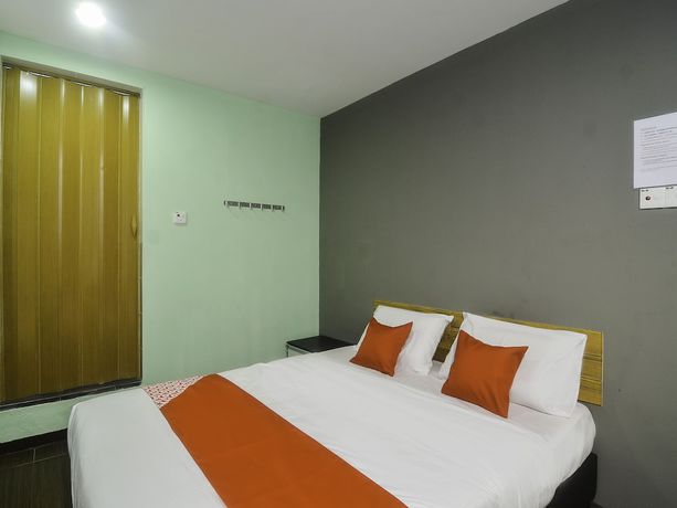 Imagen de la habitación del Hotel OYO 89465 Golden Lounge. Foto 13
