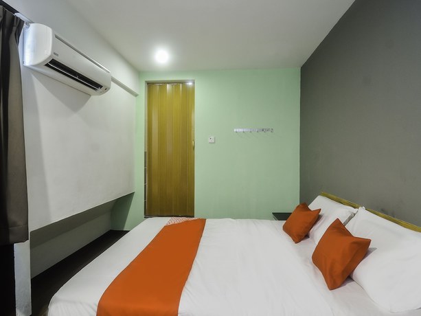 Imagen de la habitación del Hotel OYO 89465 Golden Lounge. Foto 17