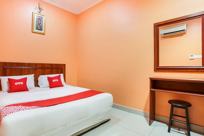 Imagen de la habitación del Hotel OYO 89470 My Town Hotel. Foto 12