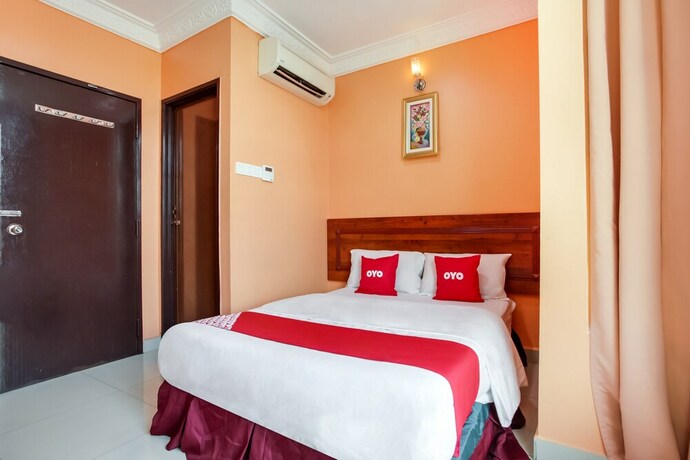 Imagen de la habitación del Hotel OYO 89470 My Town Hotel. Foto 16