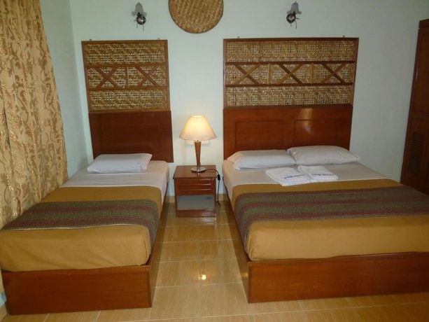 Imagen de la habitación del Hotel OYO 89488 Pcb Resort. Foto 7
